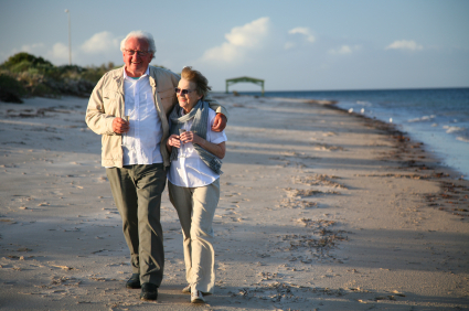 Senior couple walking on beach