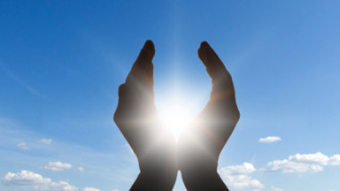hand cupped to sun