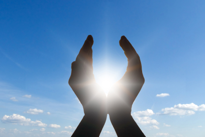 hand cupped to sun